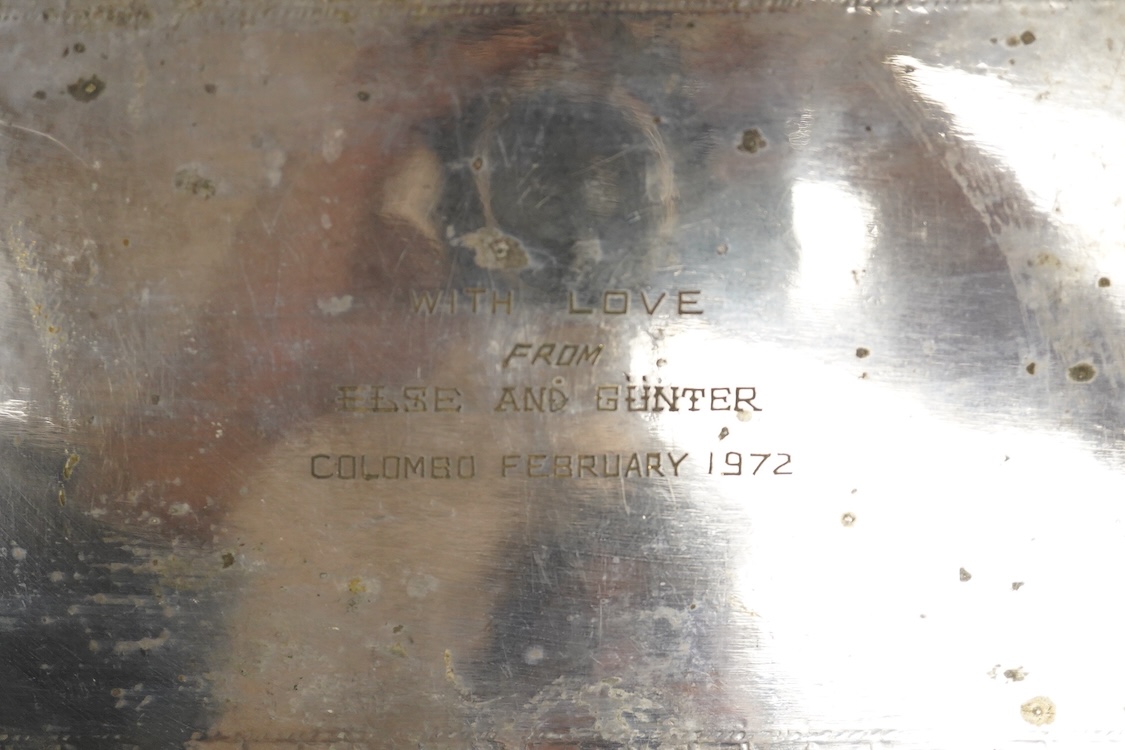 A 20th century Indian colonial white metal tray, with engraved decoration and personal inscription to the base, 39.6cm, 21.1oz.